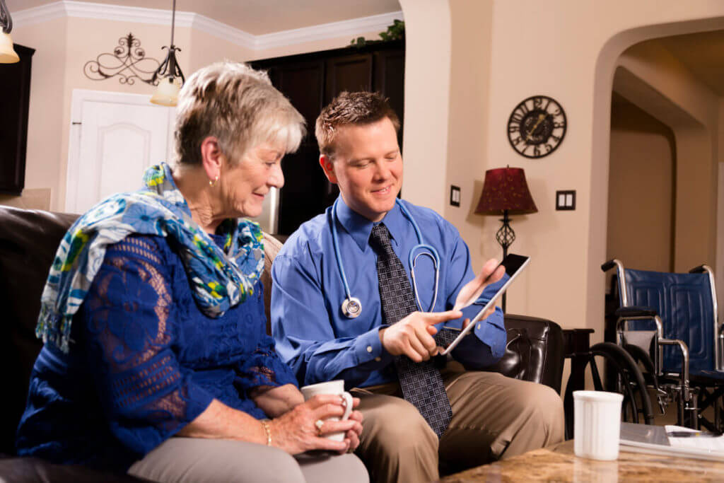 Concierge medicine doctor visits senior woman at home