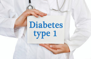 Image of a card with Diabetes Type 1 written on it, held by a medical doctor against a white background.