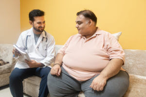 A healthcare worker advised an obese man to lose weight and discussed the health risks of being overweight.